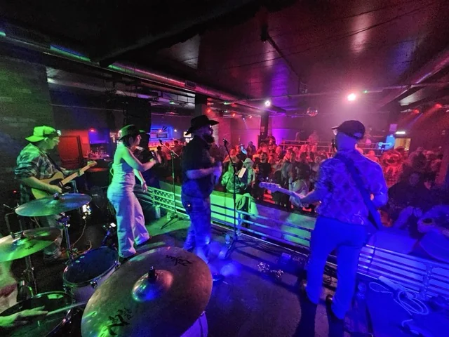 Next Stop Nashville performing to a busy indoor venue