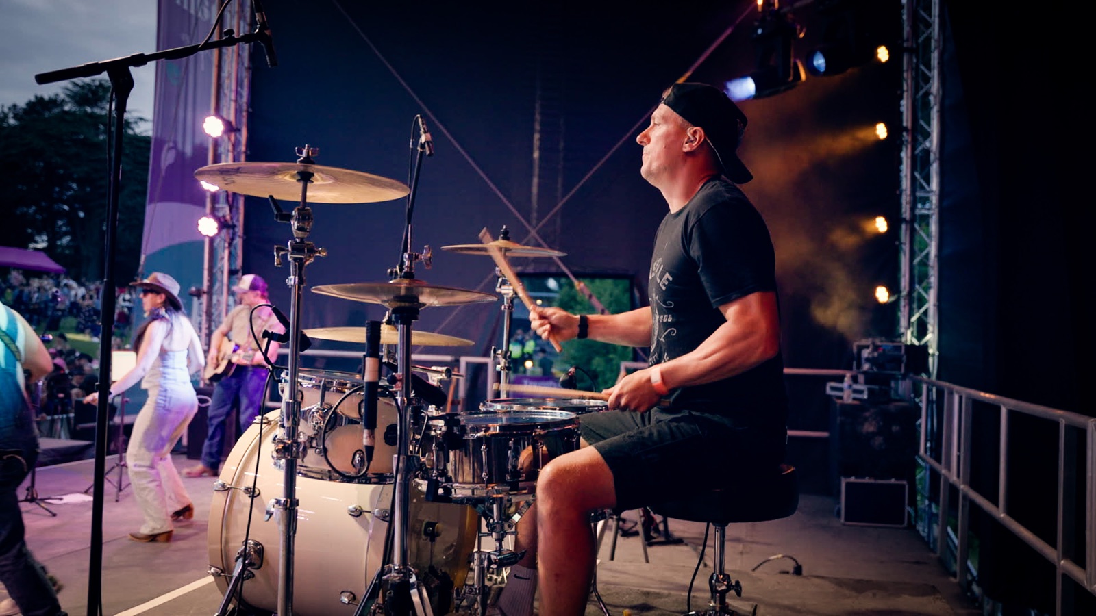 Martin playing drums on a festival stage